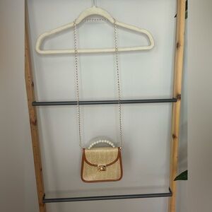 Woven crossbody bag with faux pearls